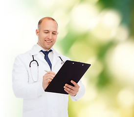 Image showing smiling male doctor with clipboard and stethoscope