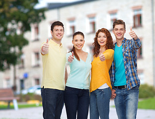 Image showing group of smiling teenagers over campus background