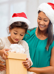 Image showing happy mother and child girl with gift box