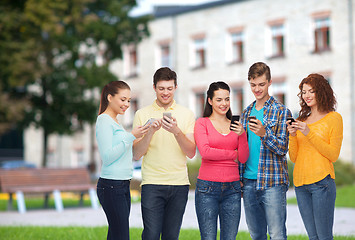 Image showing group of smiling teenagers with smartphones