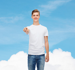 Image showing smiling young man in blank white t-shirt