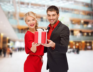 Image showing smiling man and woman with present