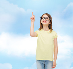 Image showing smiling cute little girl in black eyeglasses