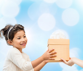 Image showing smiling little girl with gift box