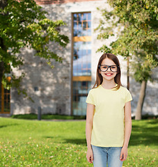 Image showing smiling cute little girl in black eyeglasses