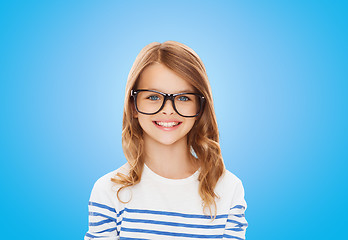 Image showing smiling cute little girl with black eyeglasses