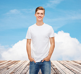 Image showing smiling young man in blank white t-shirt