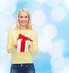 Image showing smiling girl with gift box