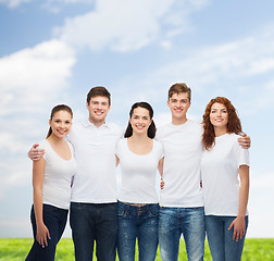 Image showing group of smiling teenagers in white blank t-shirts