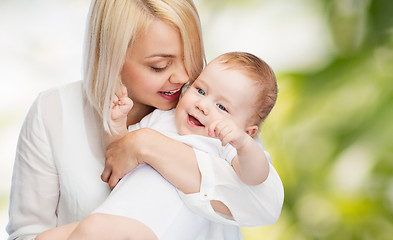 Image showing happy mother with smiling baby