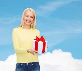 Image showing smiling girl with gift box