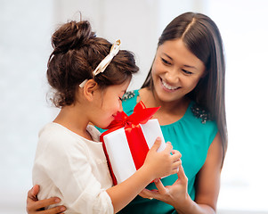 Image showing happy mother and child girl with gift box