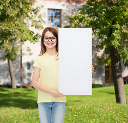 Image showing little girl wearing eyeglasses with blank board