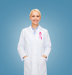 Image showing smiling female doctor with cancer awareness ribbon