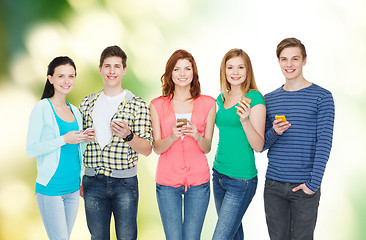 Image showing smiling students with smartphones