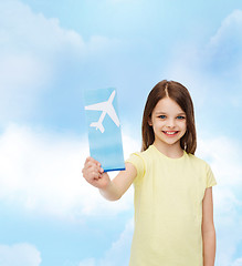 Image showing smiling little girl with airplane ticket