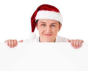 Image showing Young man in Santa hat