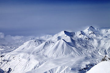 Image showing Snowy mountains in mist