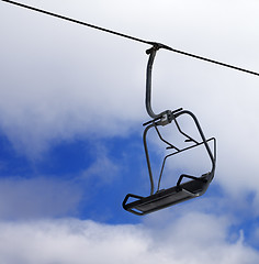 Image showing Chair-lift and cloudy sky