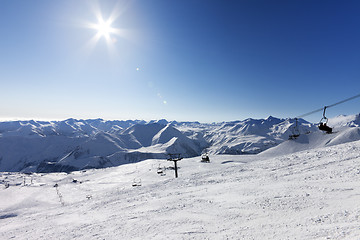 Image showing Ski slope and sky with sun
