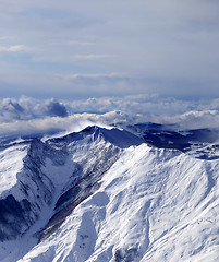 Image showing Winter mountains in mist at windy winter day