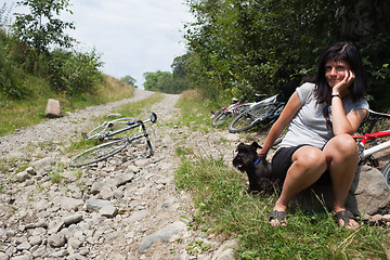 Image showing Woman with her ??dog resting