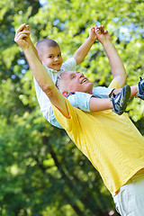 Image showing happy grandfather and child in park