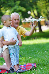 Image showing happy grandfather and child in park