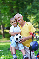 Image showing happy grandfather and child in park