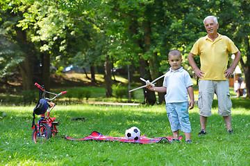 Image showing happy grandfather and child in park