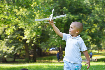 Image showing boy with airpane