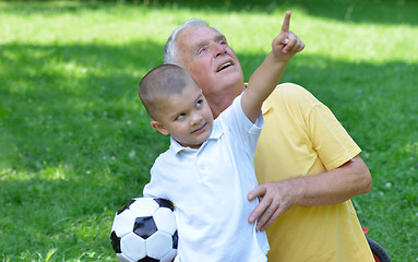 Image showing happy grandfather and child in park