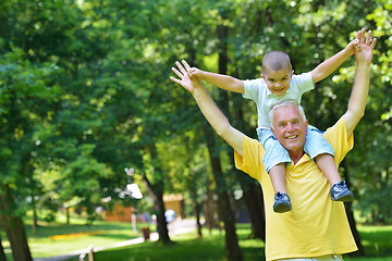 Image showing happy grandfather and child in park