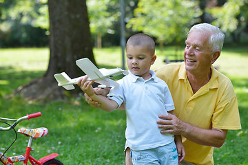 Image showing happy grandfather and child in park