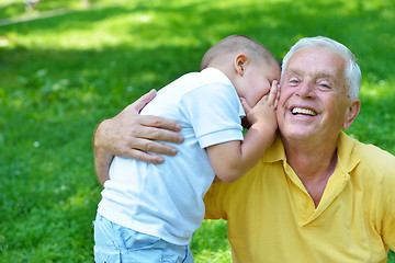 Image showing happy grandfather and child in park