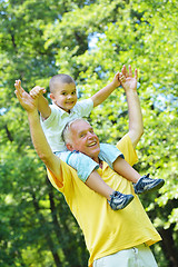 Image showing happy grandfather and child in park