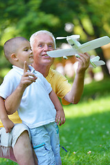 Image showing happy grandfather and child in park