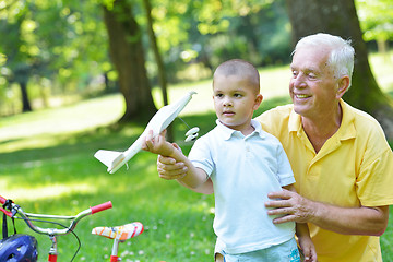 Image showing happy grandfather and child in park