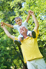 Image showing happy grandfather and child in park