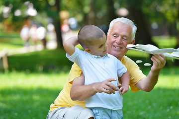 Image showing happy grandfather and child in park