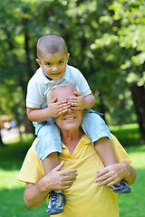 Image showing happy grandfather and child in park