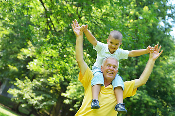 Image showing happy grandfather and child in park