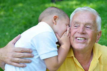 Image showing happy grandfather and child in park