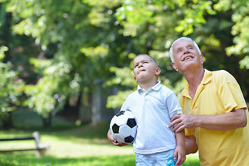 Image showing happy grandfather and child in park