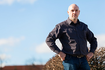 Image showing Thoughtful man sitting on a flight of steps