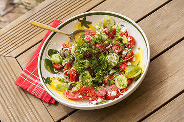 Image showing Bowl of Marinated Greek Salad with Red Napkin