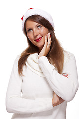 Image showing Attractive woman wearing a festive red Santa hat