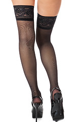 Image showing Sexy female legs in stilettos and stockings