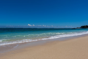 Image showing Beautiful tropical beach with lush vegetation