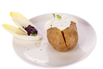 Image showing Baked jacket potato with sour cream sauce